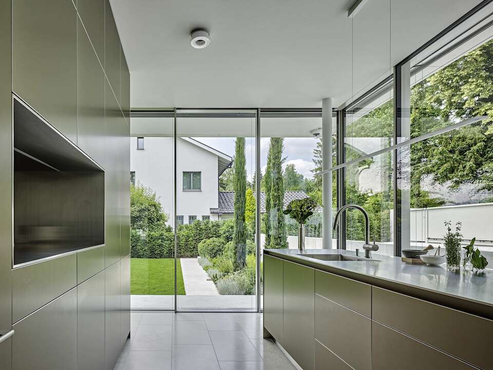 Kitchen in a glass house villa with 360° views